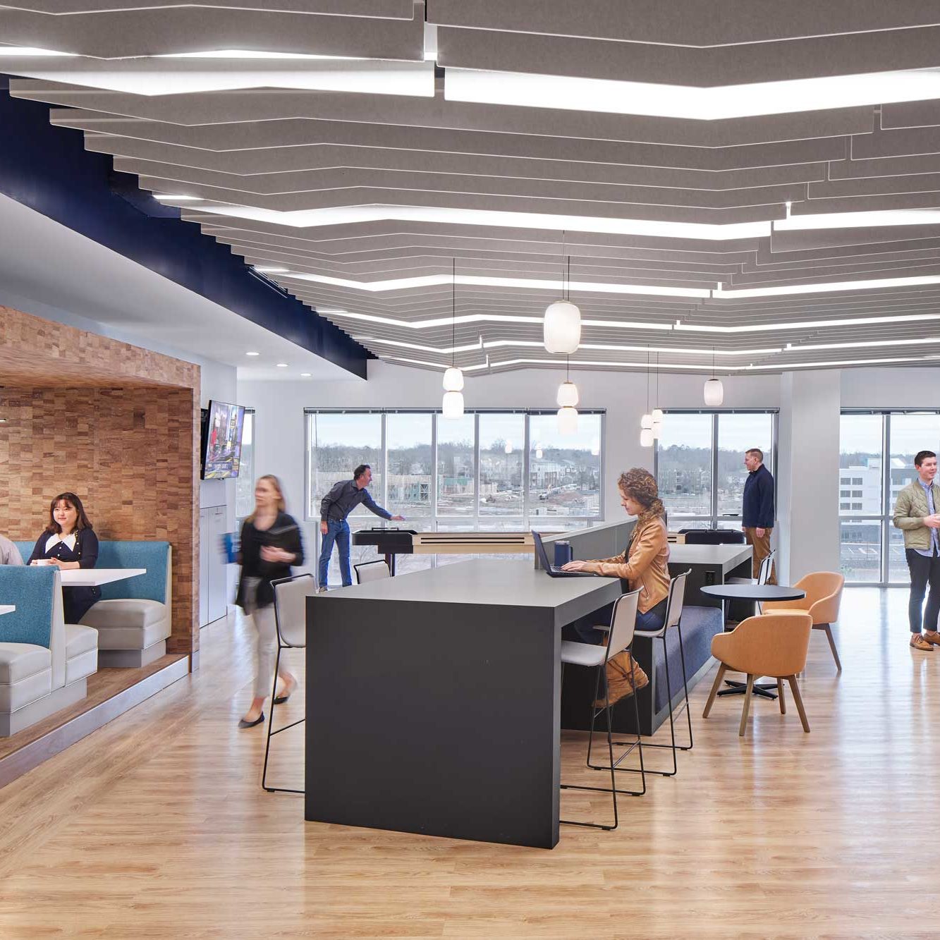 Acoustic panels and pendant lighting installed in a service center