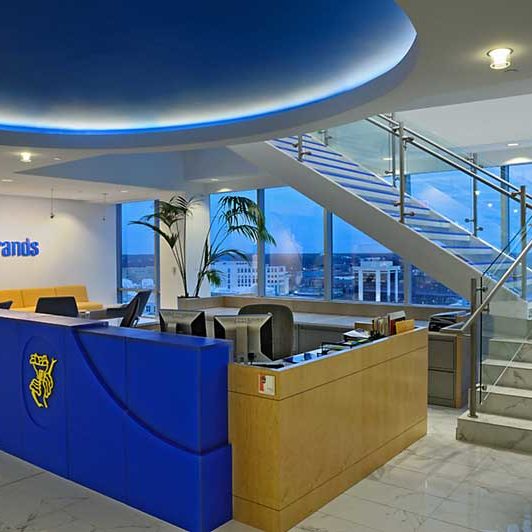 Ceiling mount and pendant lighting in a corporate lobby