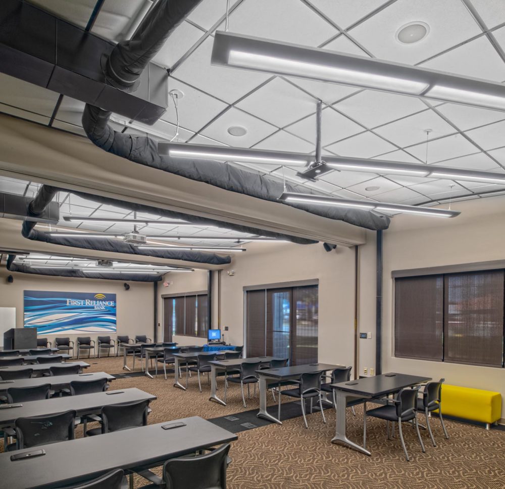 Suspended linear lighting inside a bank