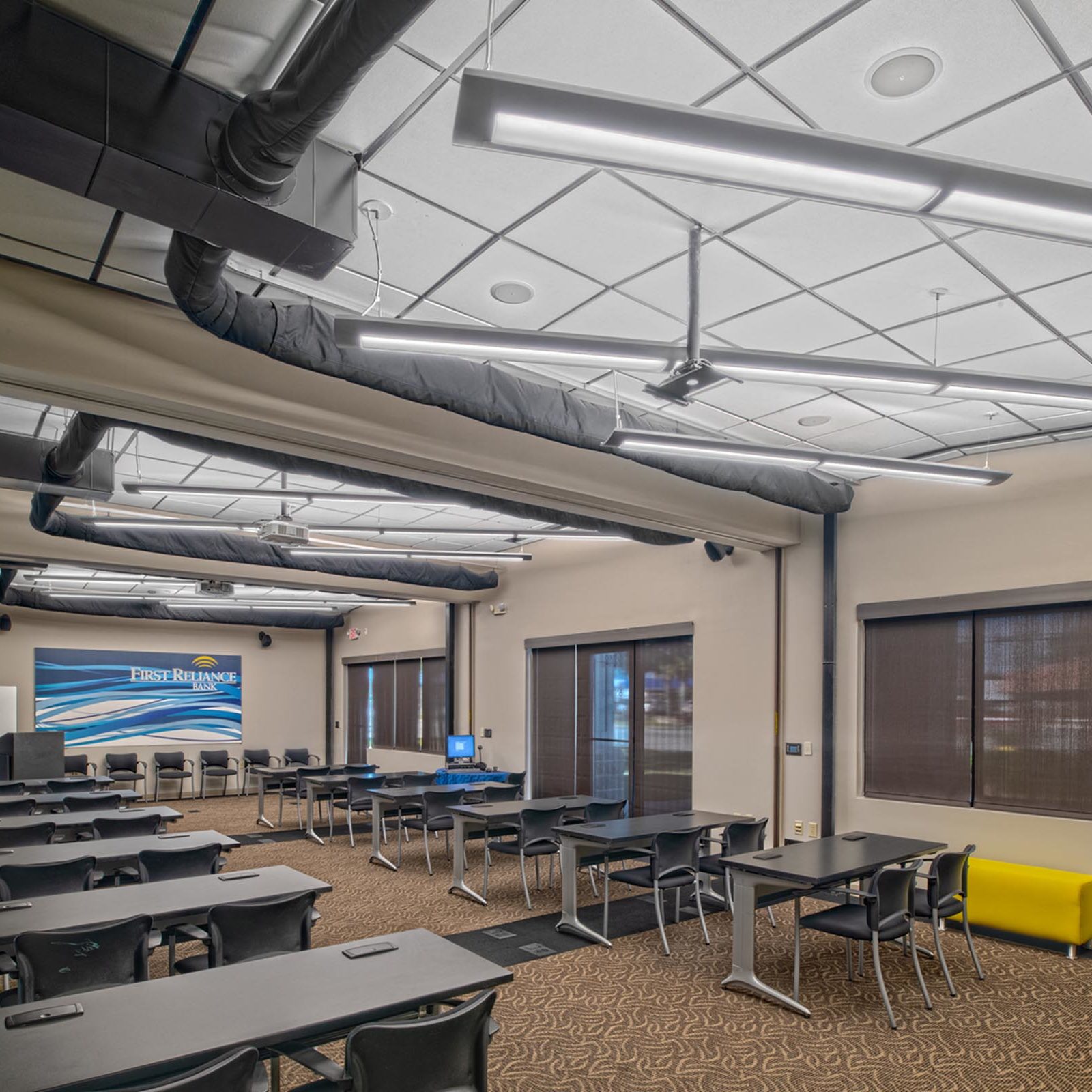 Suspended linear lighting inside a bank