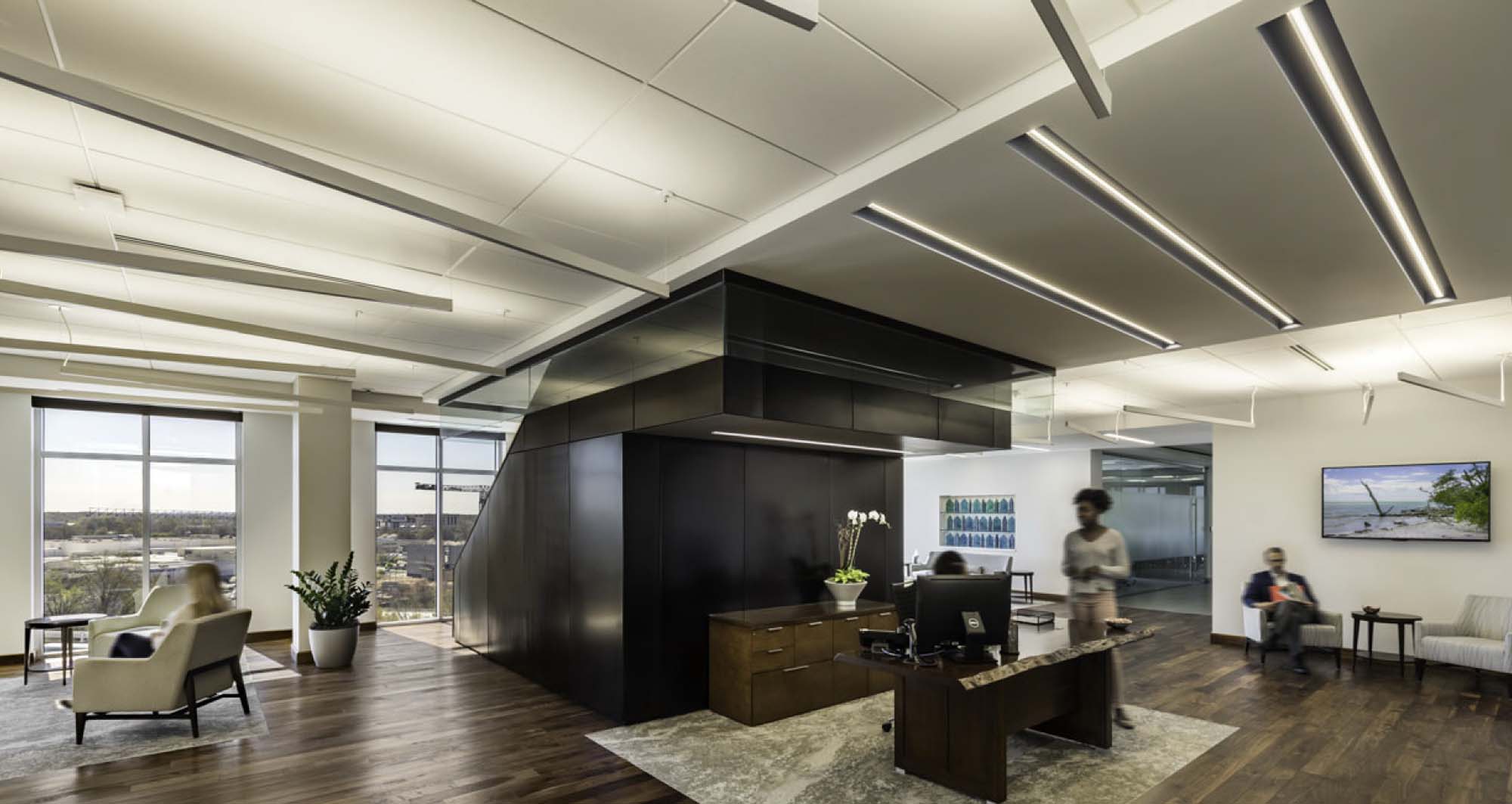 Suspended linear lighting in an office lobby