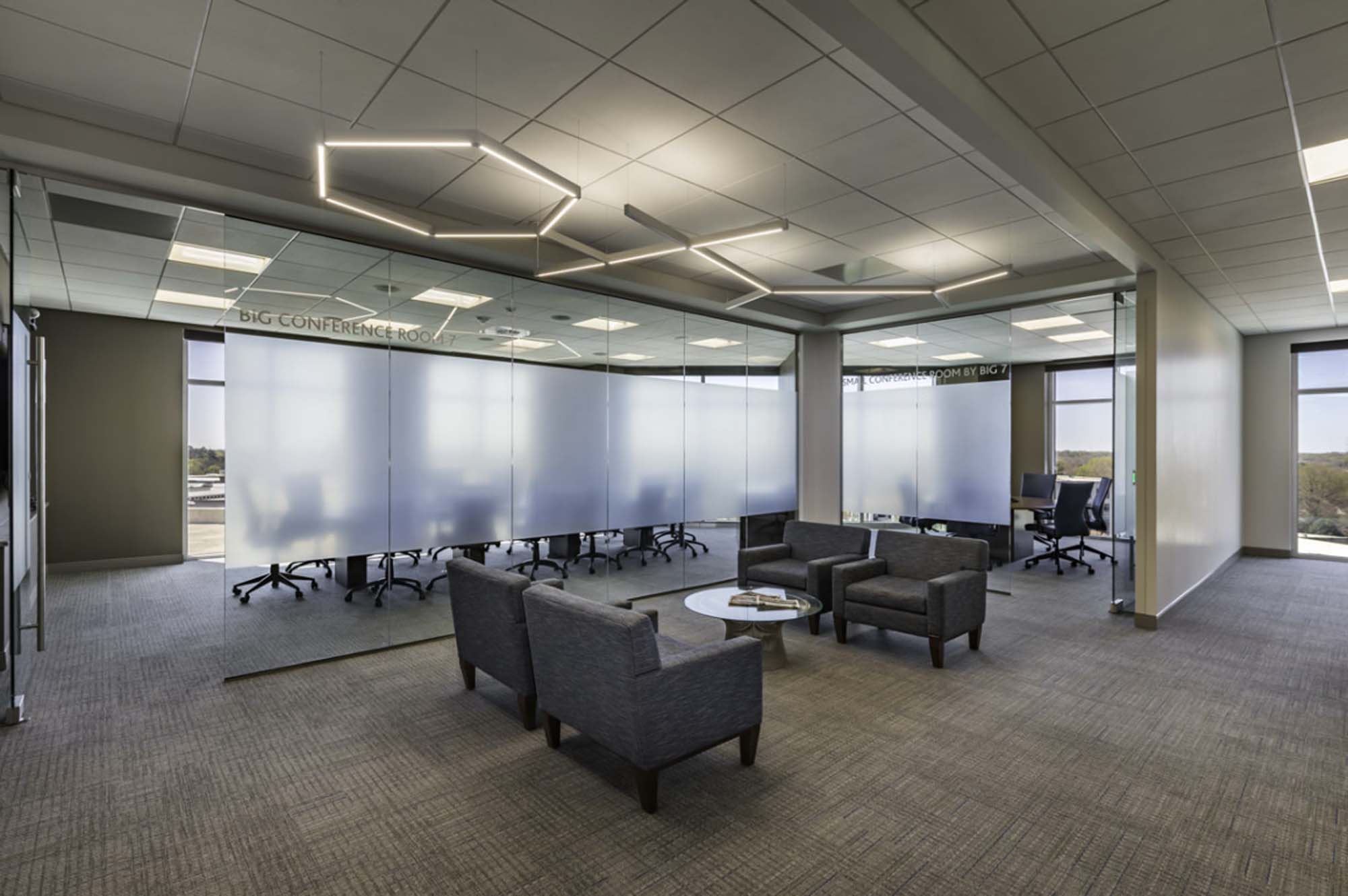 Geometric suspended lighting in an office space